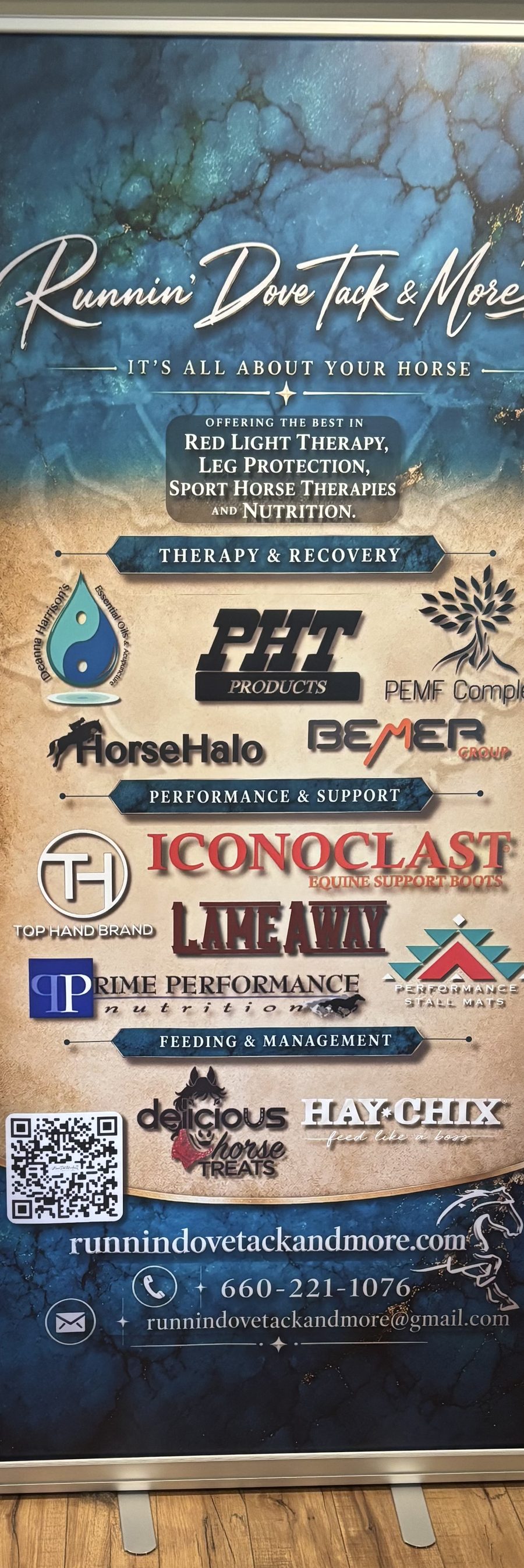 Runnin' Dove Tack & More retractable trade show banner designed by Iron Sharp Media, featuring the shop's brand, product categories, sponsor logos, QR code, and contact info